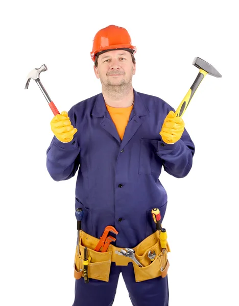 Trabajador en sombrero duro sosteniendo martillos — Foto de Stock