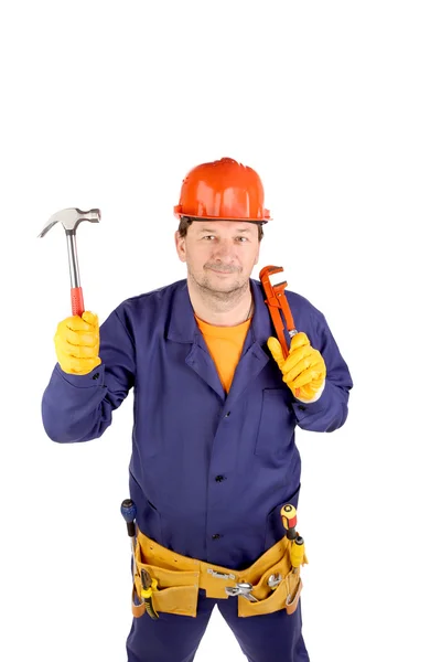 Arbetstagaren anläggning hammare och tång — Stockfoto