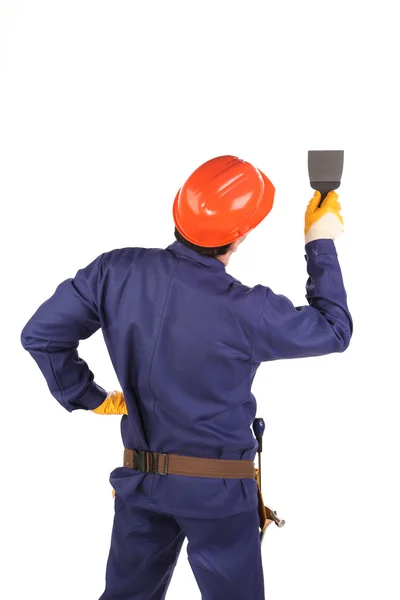 Worker in hard hat working with fretsaw — Stock Photo, Image
