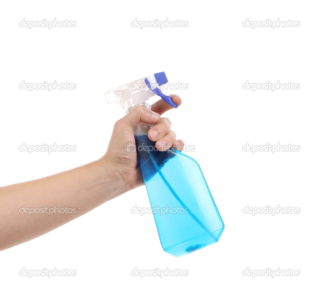 Hand holding blue plastic spray bottle