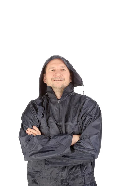Muž v nepromokavý kabát s kapucí. — Stock fotografie