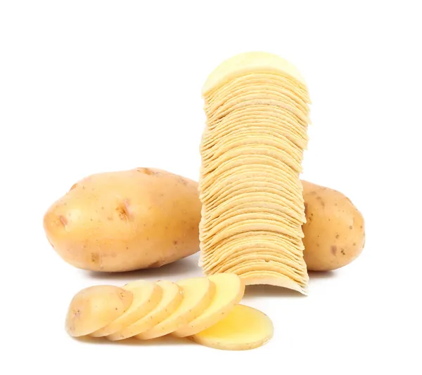 Tubers of potato and stack chips — Stock Photo, Image