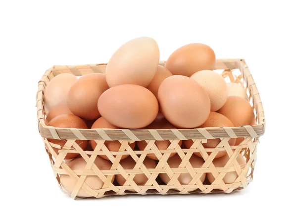 Eggs in the wicker basket — Stock Photo, Image