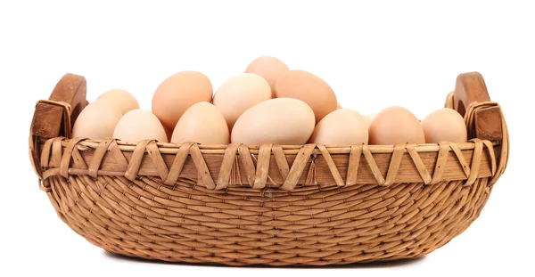 Eggs in the wicker brown basket — Stock Photo, Image