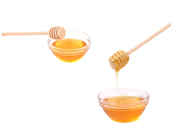 Two bowls with honey and wooden dippers — Stock Photo, Image