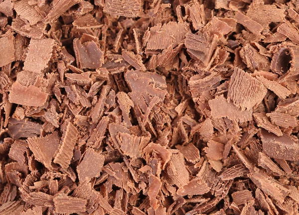 Čokoládové hobliny textura. — Stock fotografie