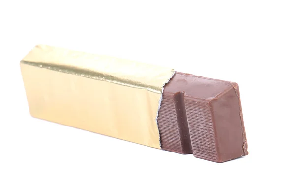 Bar of chocolate in gold foil. — Stock Photo, Image