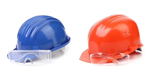 Red and blue hard hat with glasses. — Stock Photo, Image