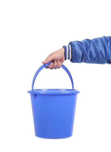 Hand holding blue bucket. — Stock Photo, Image