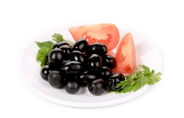 Czarne oliwki z pomidorami i pietruszka. — Zdjęcie stockowe