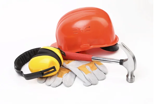 Czerwone twarde głowy rękawice i narzędzia — Zdjęcie stockowe