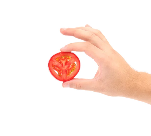 Tenir la main tranche de tomate . — Photo
