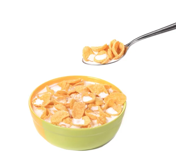 Bowl of sugar-coated corn flakes and spoon. — Stock Photo, Image