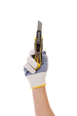Hand in gloves holds office knife. clipart