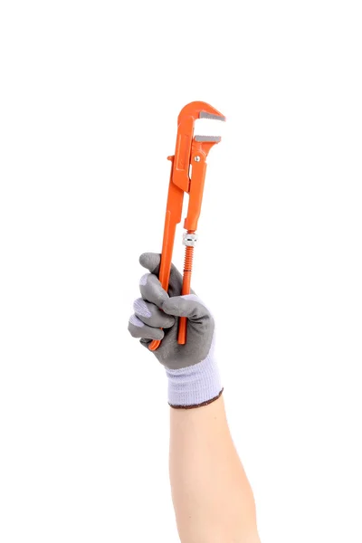 Hand in gloves holding wrench. — Stock Photo, Image