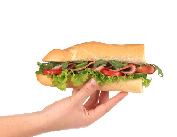 Half of french baguette sandwich in hand. — Stock Photo, Image