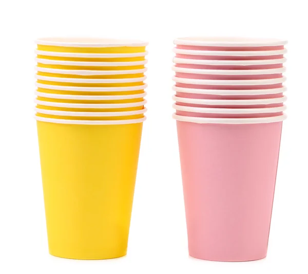 Twee gele en roze stapels papier cups. — Stockfoto