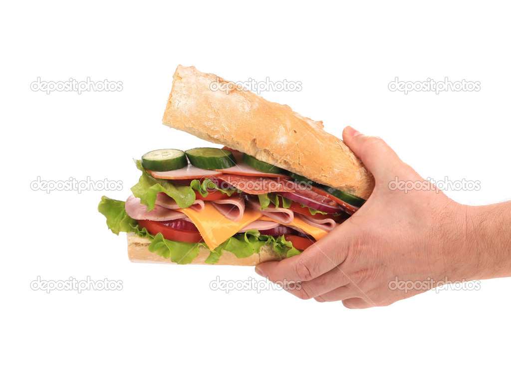 Big fresh sandwich in hands.