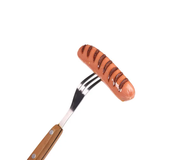 Grilled sausage on a fork. — Stock Photo, Image