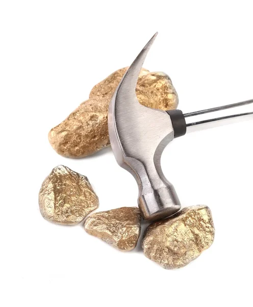 Closeup of metal hammer with gold nuggets. — Stock Photo, Image
