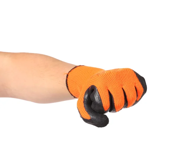 Vuist in rubber Oranje handschoen. — Stockfoto