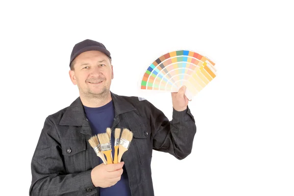 Dělník s vzorky barev a štětce — Stock fotografie