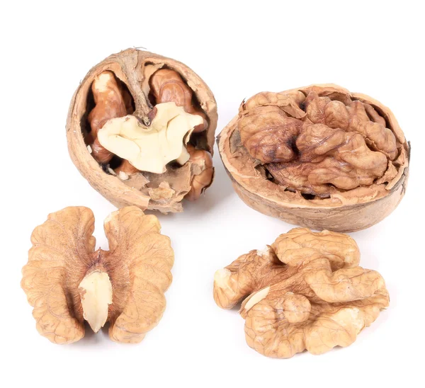 Close up of walnuts and kernels. — Stock Photo, Image