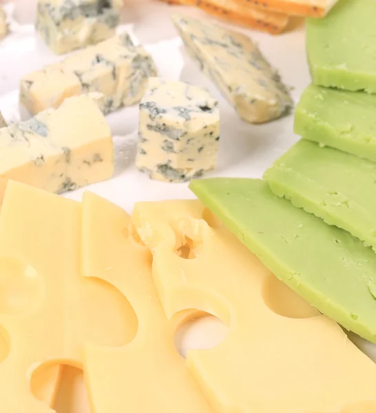 Various types of cheese on wooden platter. — Stock Photo, Image