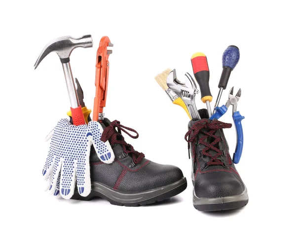Werken laarzen met een aantal verschillende tools — Stockfoto
