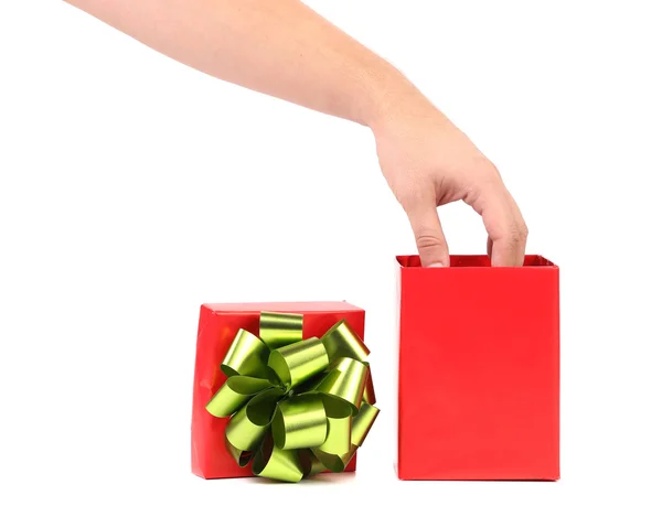 用一只手在它的红色礼品盒. — 图库照片