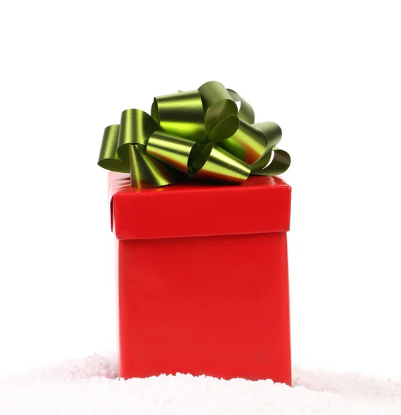 Red gift box with green-golden bow. — Stock Photo, Image