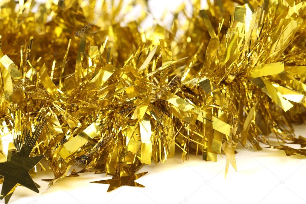Close up of christmas yellow tinsel with stars. — Stock Photo