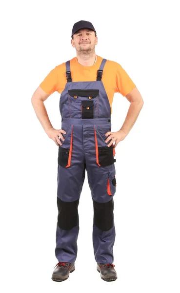 Gelukkig werknemer dragen van Amerikaanse overalls. — Stockfoto