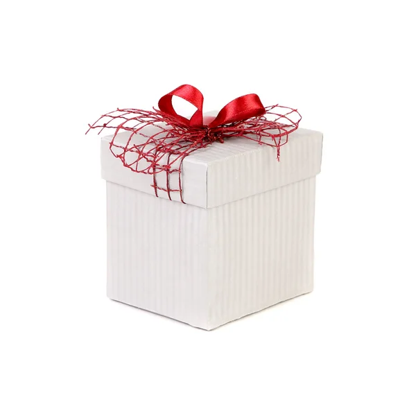 White gift box with red ribbon bow. — Stock Photo, Image