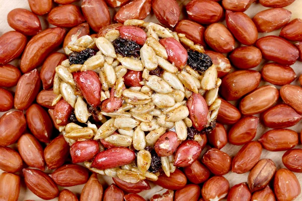 Round candied seeds and nuts with peanuts. — Stock Photo, Image