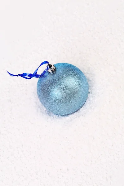 Blue christmas ball in snow. — Stock Photo, Image
