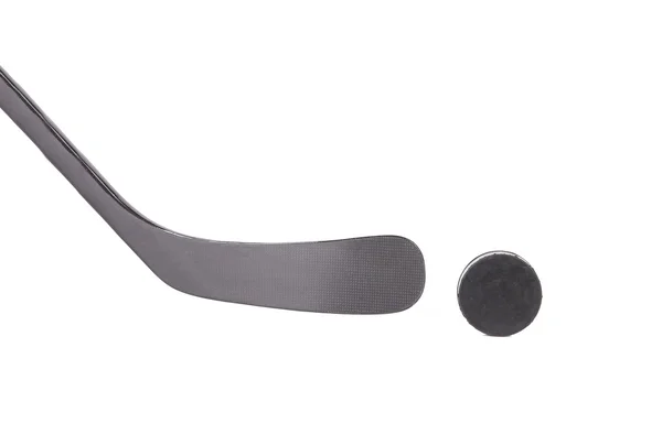 Black ice hockey stick and puck. — Stock Photo, Image