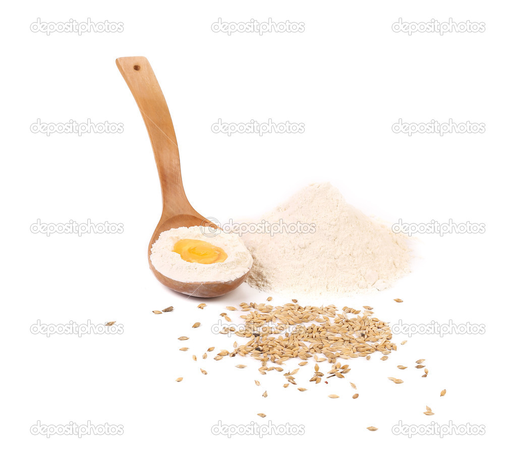 Egg yolk in spoon with flour.