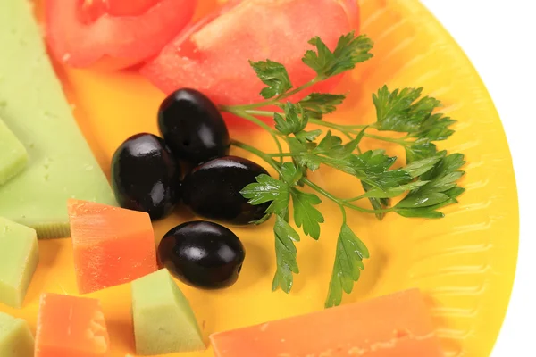 Various cheese on yellow platter. — Stock Photo, Image