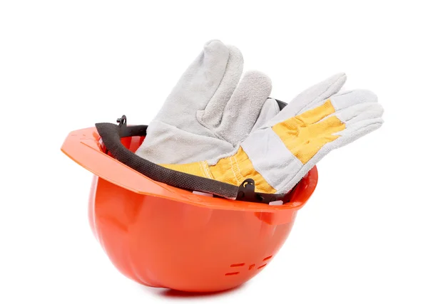 Red hard hat with leather gloves. — Stock Photo, Image