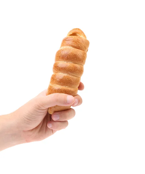 Hand holds hot dog baked. — Stock Photo, Image