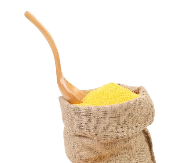 Cornmeal in bag with spoon. — Stock Photo, Image