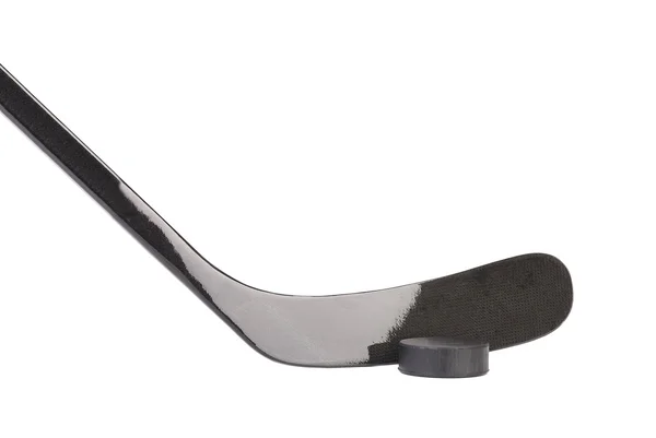 Black ice hockey stick and puck. — Stock Photo, Image