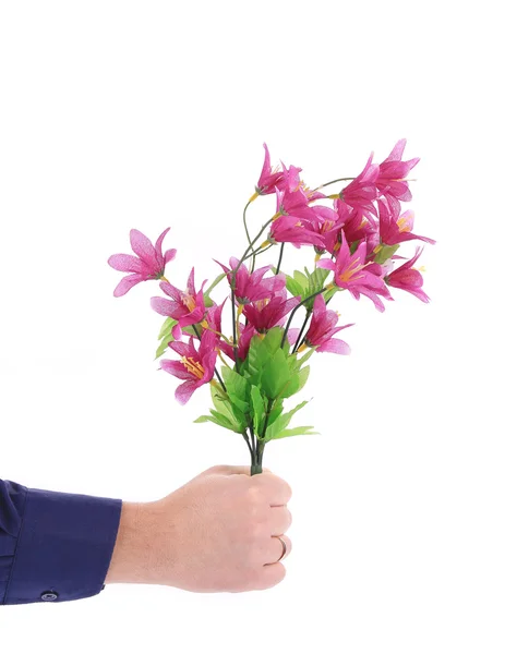 Hand houdt boeket van bloemen. — Stockfoto