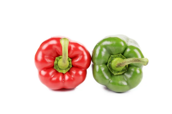 Two red and green peppers close up. — Stock Photo, Image