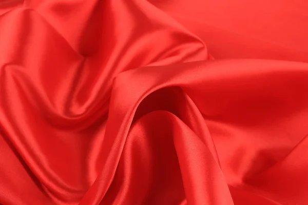 Close up de fundo de tecido de seda vermelha . — Fotografia de Stock