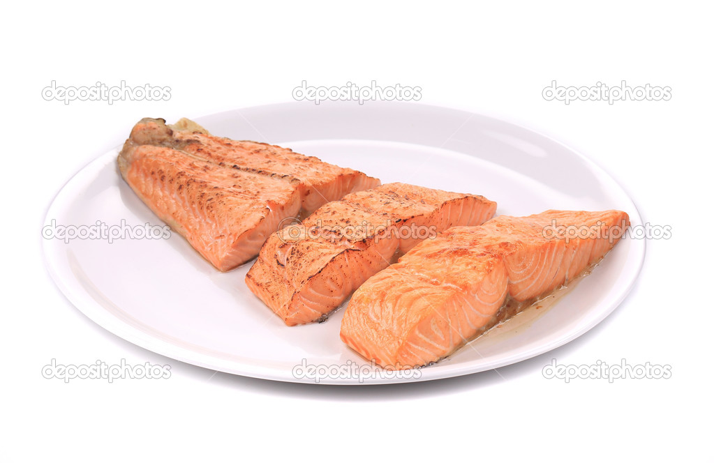 Slices of red fish fillet on plate.