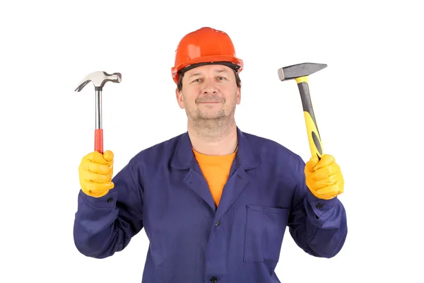 Trabajador en sombrero duro sosteniendo martillos —  Fotos de Stock