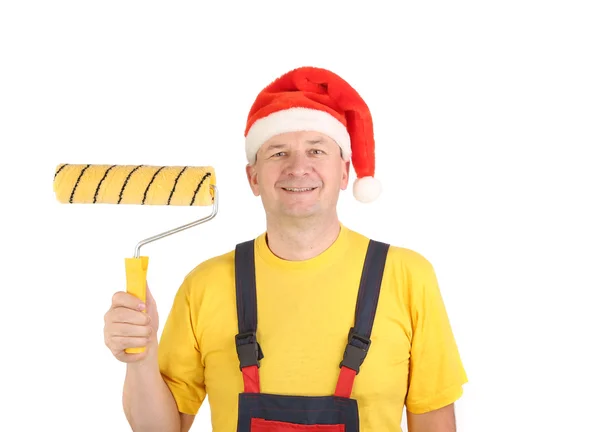 工人在圣诞老人的帽子与辊 — 图库照片