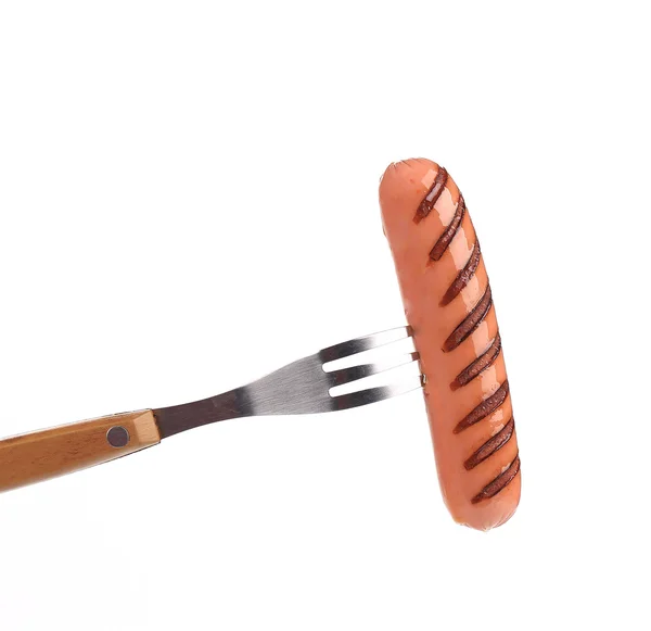 Grilled sausage on a fork — Stock Photo, Image